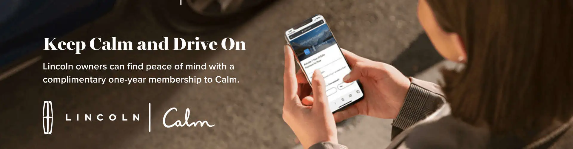 Person holding phone with Calm app; Lincoln offers a 1-year Calm membership.