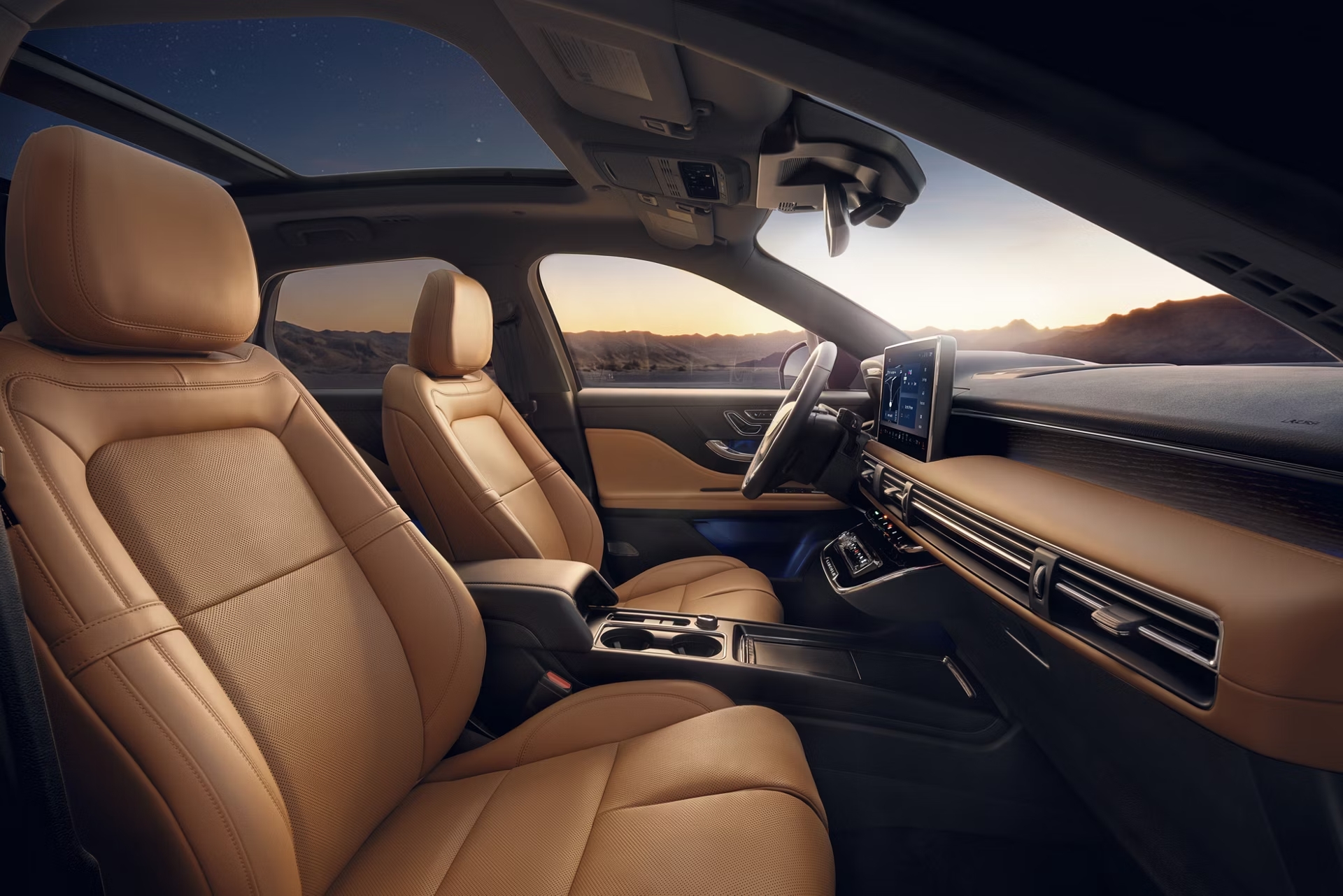 Luxurious car interior with tan leather seats, panoramic sunroof, and digital dashboard.